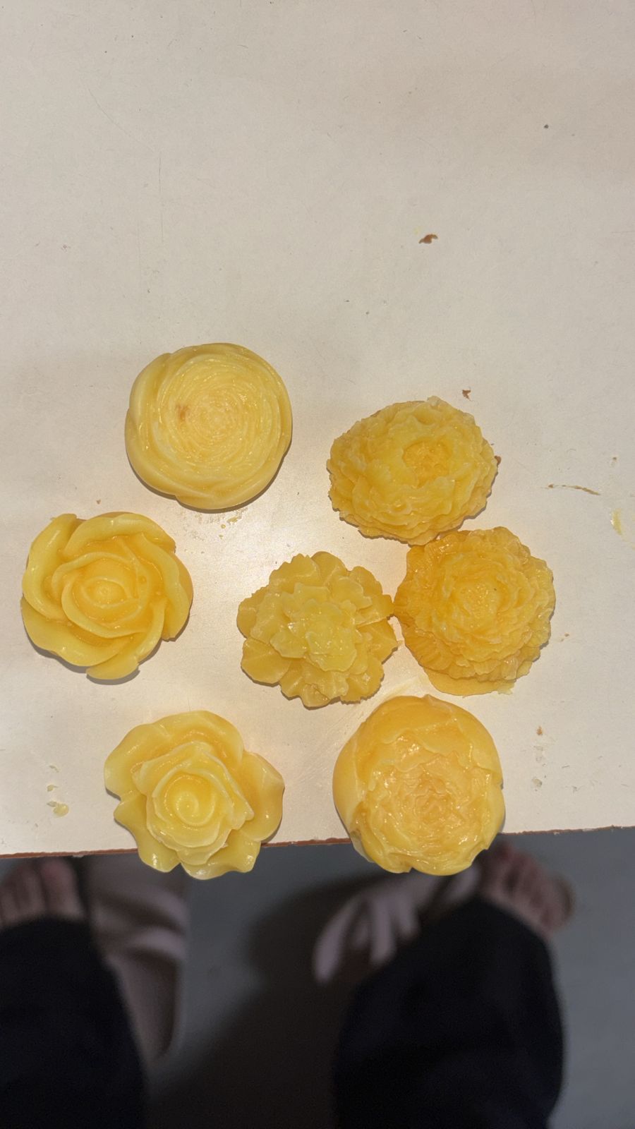 Sunrise yellow handcrafted soap roses arranged on a light background